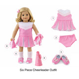 Doll wearing a pink cheerleader outfit with separate items displayed. Pink cheerleader 6-piece outfit for 18-inch doll with dress, pom-poms, shoes, socks, and megaphone.